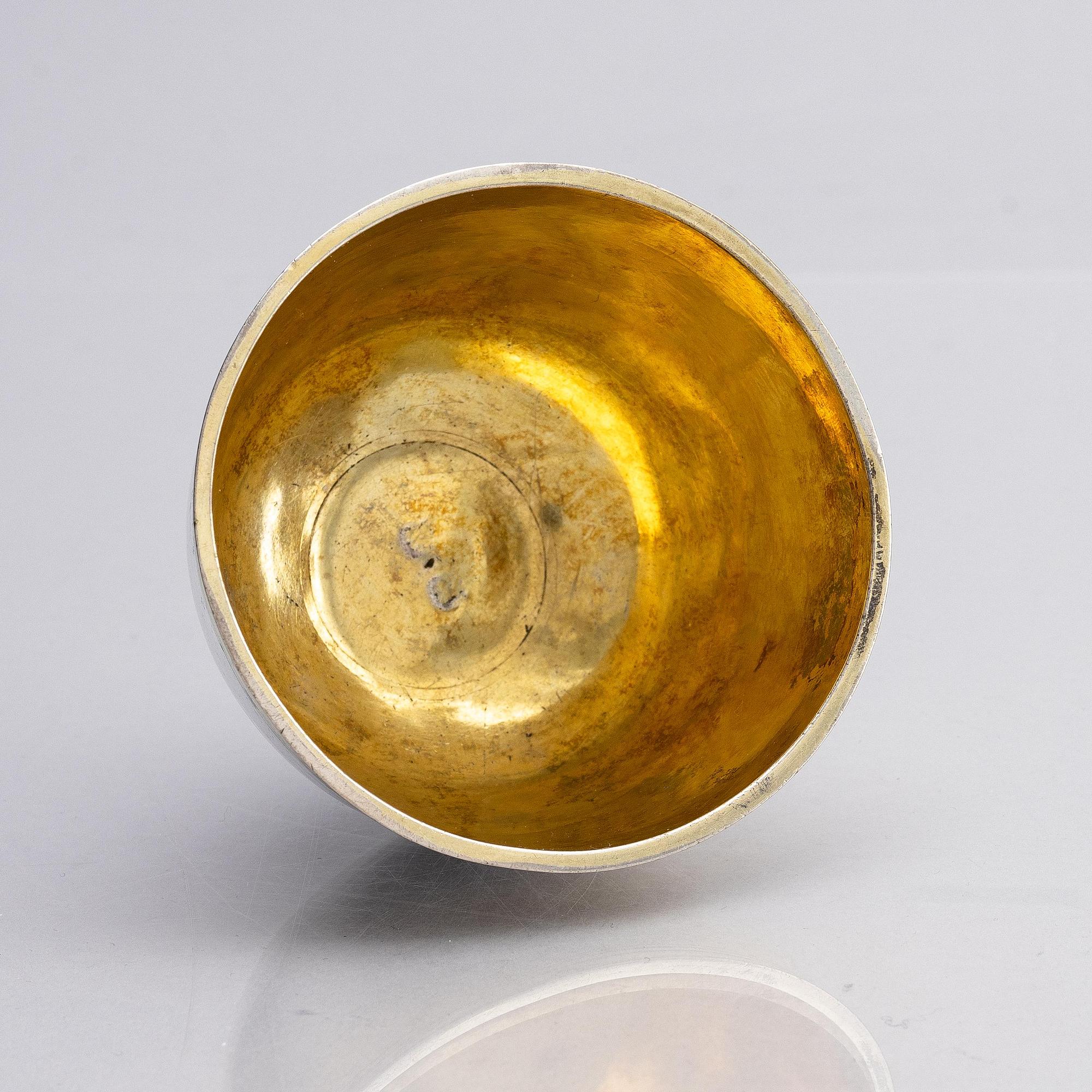 An Estonian parcel-gilt silver tumbler, mark of Jacob Fleischmann, (active in Arensburg 1675-1698).
