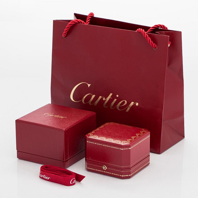 Cartier, sormus, allianssisormus, platinaa ja briljanttihiottuja timantteja.