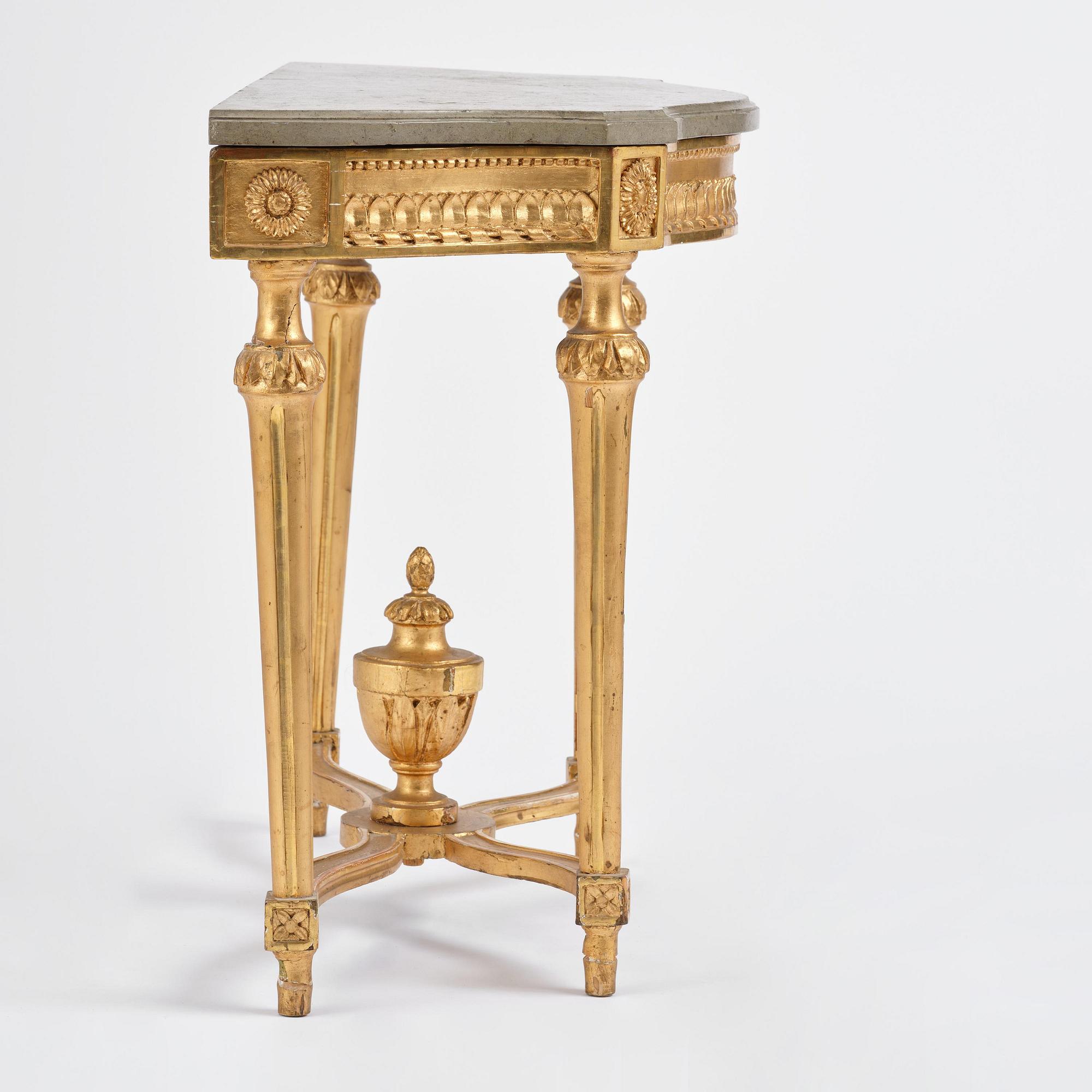 A Gustavian giltwood and limestone-top console table, Stockholm, late 18th century.