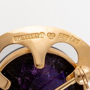 Brosch, Atelier Borgila, 18K guld med cabochonslipad ametist.