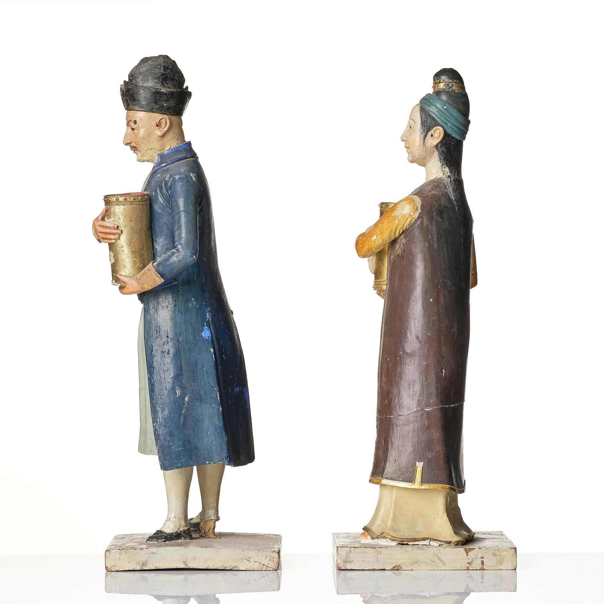 A pair of Chinoiserie figures of a Parsi tradesman and his wife, Qing dynasty, Canton, 19th century.