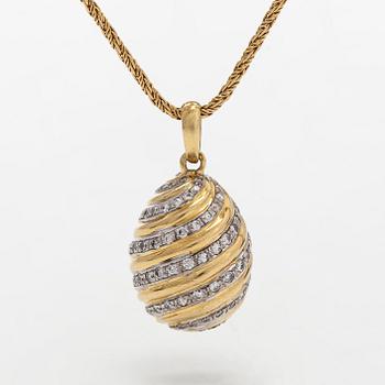 Cartier, hänge "Pendentif Oeuf " med  diamanter samt kedja, 18K guld.