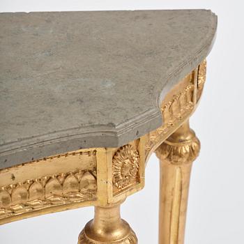 A Gustavian giltwood and limestone-top console table, Stockholm, late 18th century.