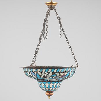 An enamelled metal lamp, Qajar dynasty (1789–1925).