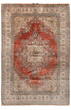 357. A semi-antique Turkish silk and metal carpet, 294 x 198 cm.