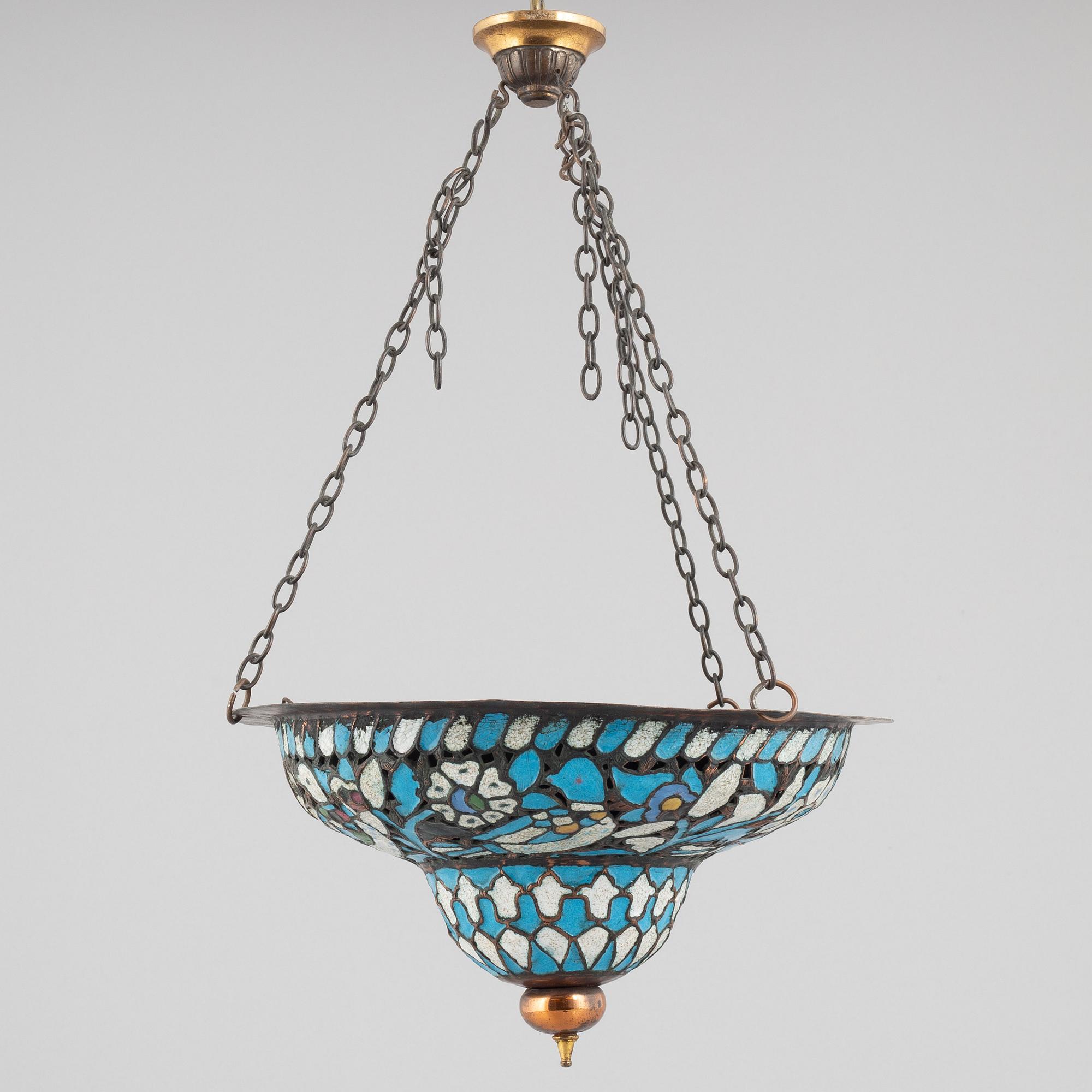 An enamelled metal lamp, Qajar dynasty (1789–1925).