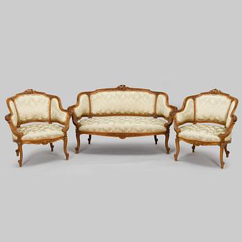 A sofa and a pair of armchairs, circa 1900.