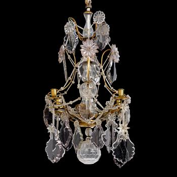 97. A late baroque gilt brass and cut glass four-light chandelier, Stockholm, mid 18th century.