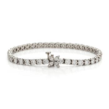 Tiffany & Co, a platinum 'Victoria' tennis bracelet, set with brilliant- and marquise-cut diamonds.