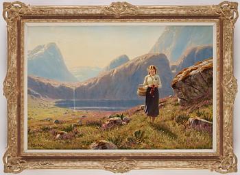 Hans Dahl, Young woman in a fjord landscape.