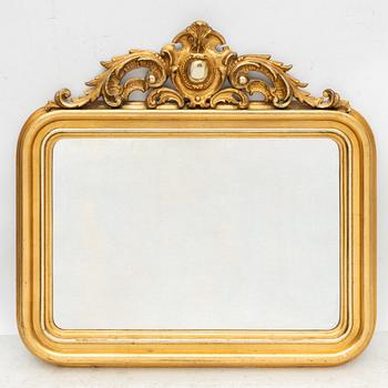 A rococo style mirror by AG Säfström Kristianstad from around the year 1900.