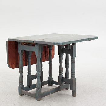 A 18th/19th century drop-leaf table.