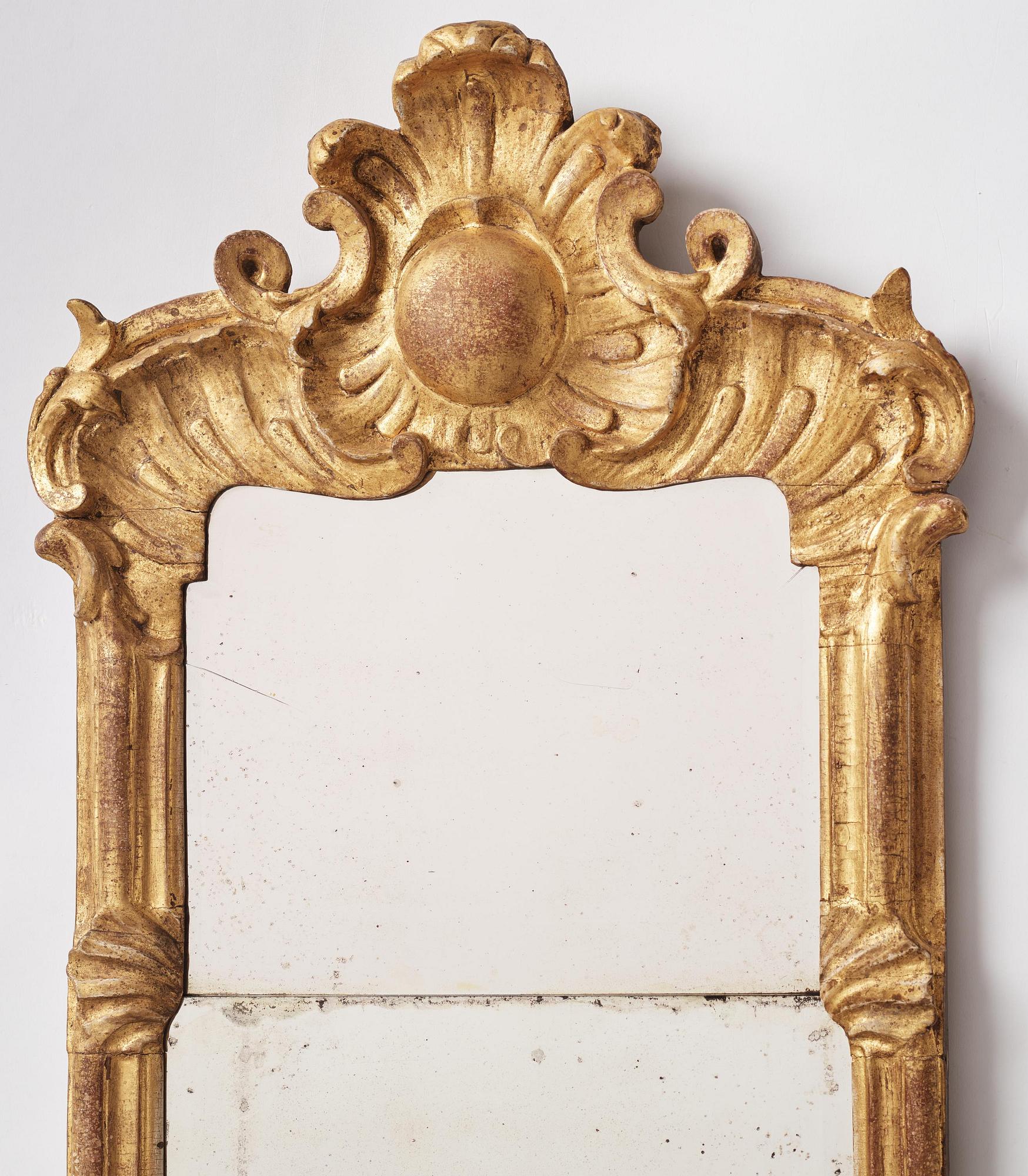 A pair of rococo giltwood two-branch girandoles, Stockholm, later part 18th century.