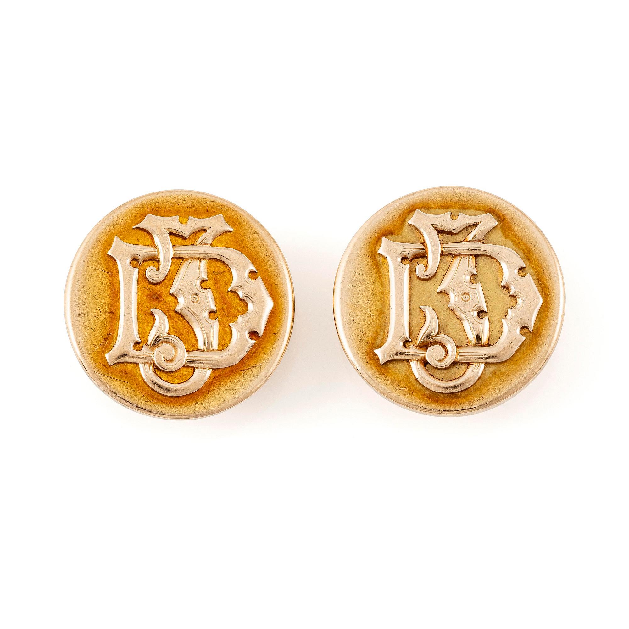 Ett par manschettknappar 14K guld med monogramgravyr.